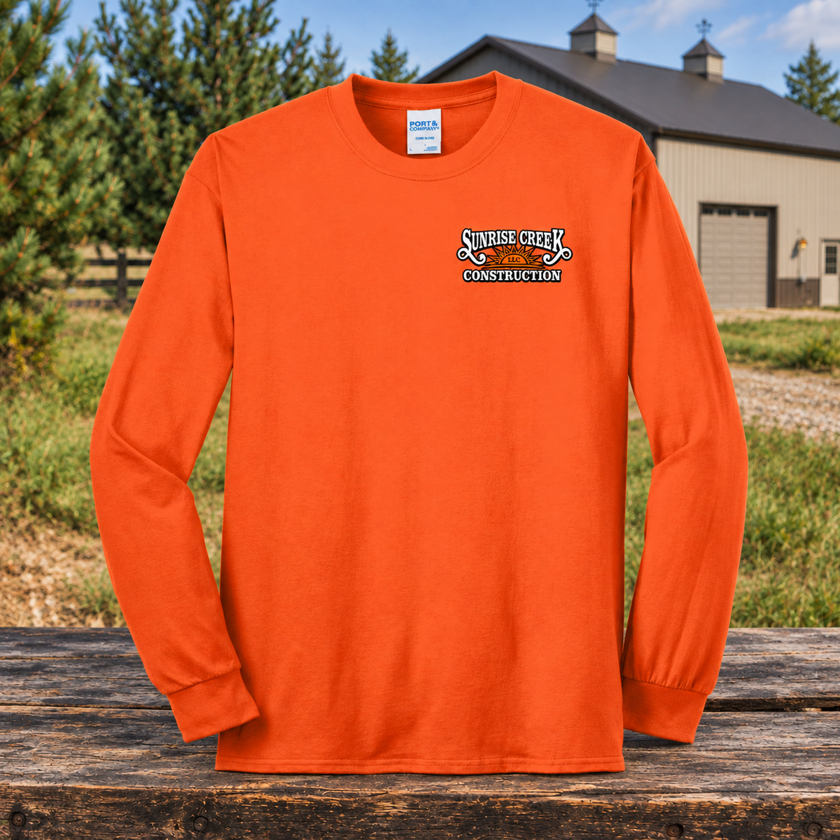 Sunrise Creek — PC55LS — Safety Orange — Front — barn and timber mockup