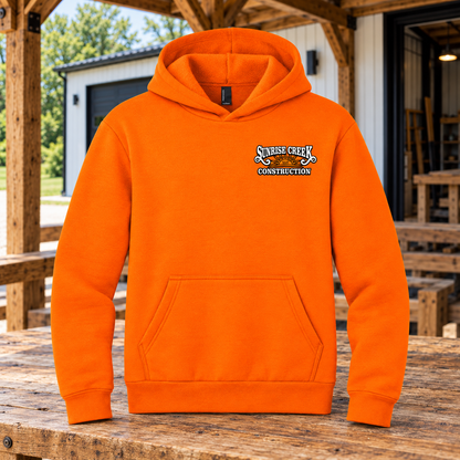 Sunrise Creek — PC68H — Safety Orange — Front — barn and timber mockup