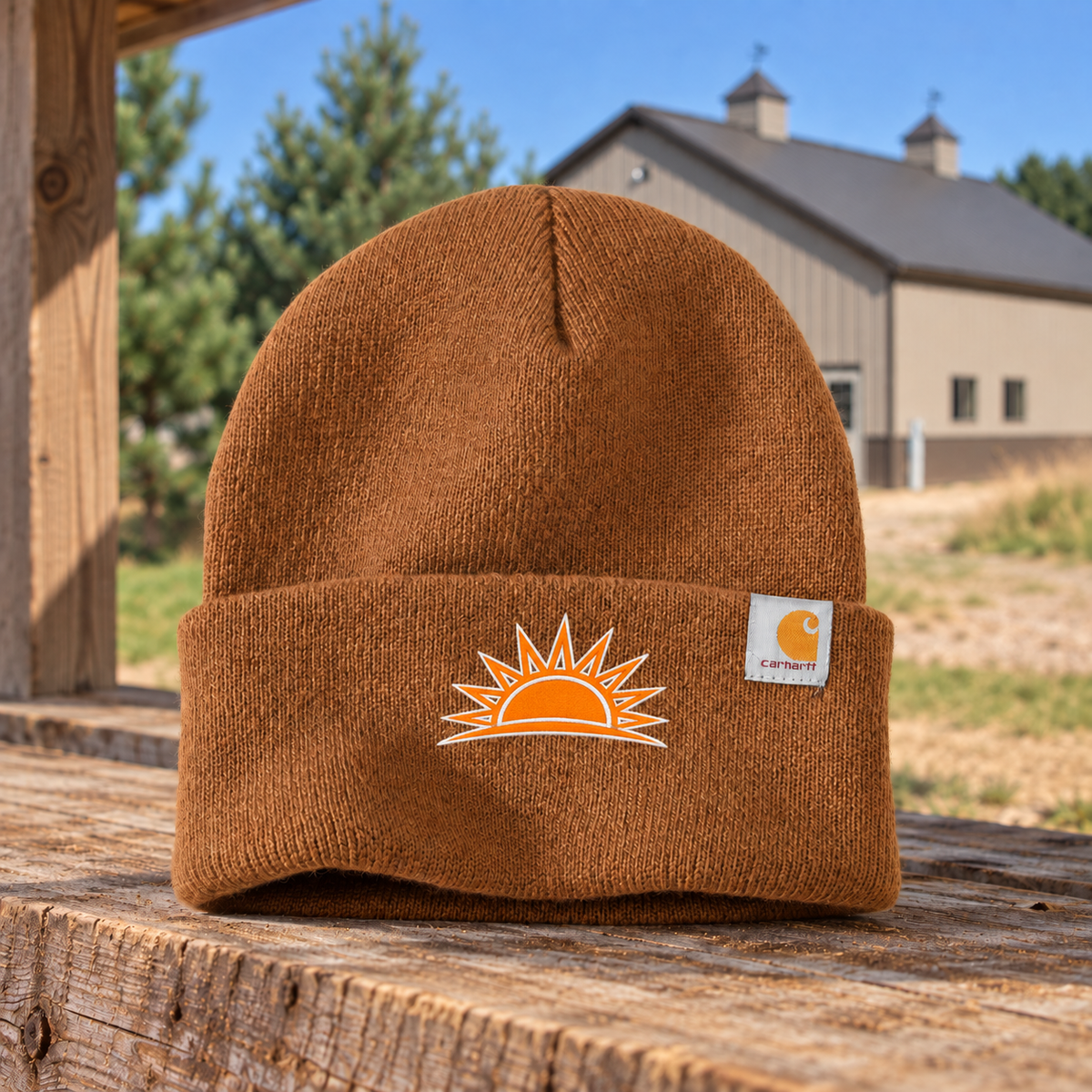 Sunrise Creek CT104597 in Carhartt/Brown — front view against a pole barn and weathered timber