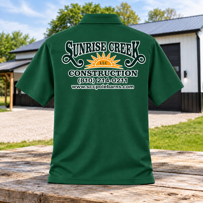 Sunrise Creek K110 in Deep/Forest/Green — back view against a pole barn and weathered timber